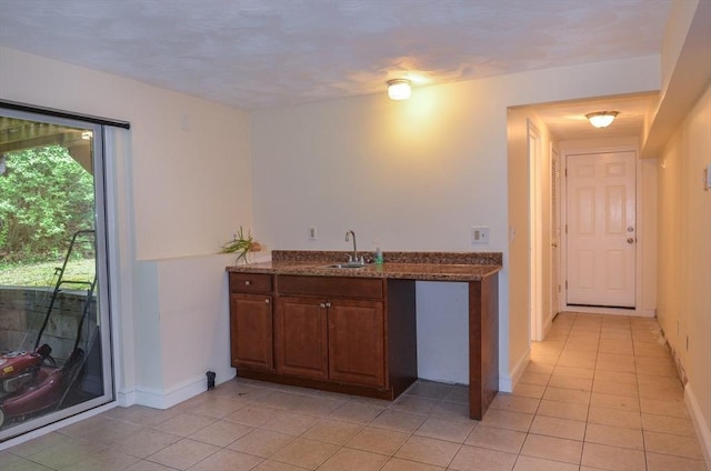 169 Lyman Rd, Berlin, MA 01503 - kitchen with light tile patterned floors and dark stone counters