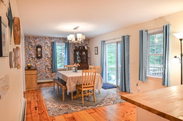 169 Lyman Rd, Berlin, MA 01503 - dining space featuring a chandelier, light wood-style flooring, and plenty of natural light