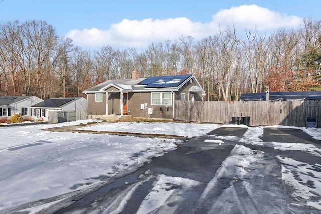 view of front of home featuring solar panels