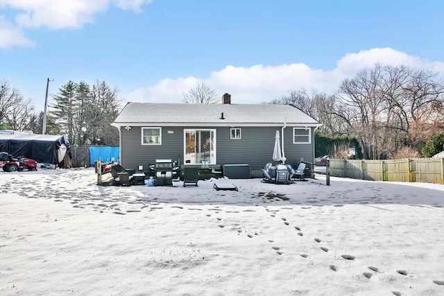 snow covered rear of property featuring outdoor lounge area