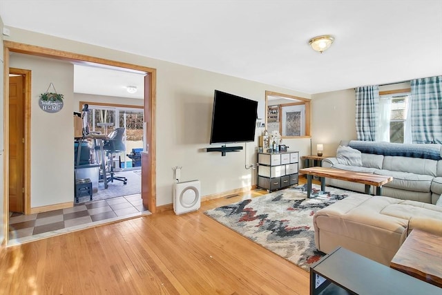 living room featuring hardwood / wood-style flooring and a wealth of natural light