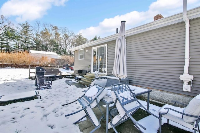 view of snow covered patio