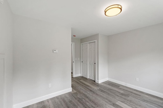 572 Pleasant St, Athol, MA 01331 - empty room featuring wood finished floors and baseboards