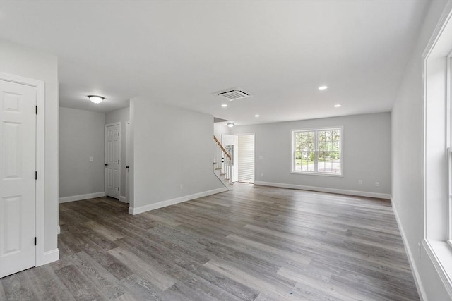 572 Pleasant St, Athol, MA 01331 - spare room featuring stairs, wood finished floors, and recessed lighting
