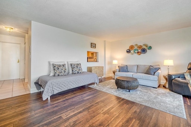 1 Summit Dr Unit 62, Reading, MA 01867 - bedroom featuring hardwood / wood-style floors and a textured ceiling