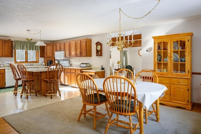 dining space with a notable chandelier