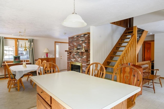 dining space featuring a brick fireplace