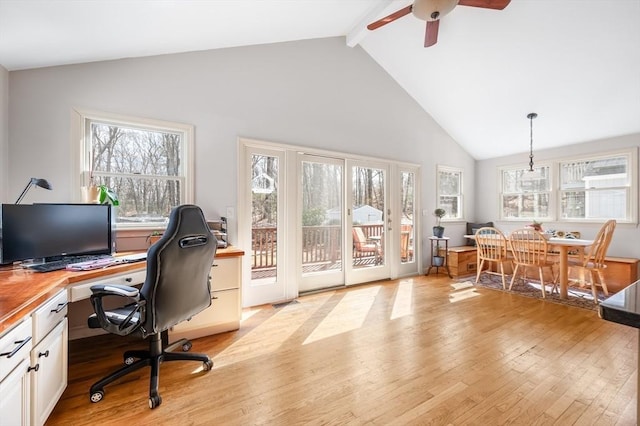 office area with beam ceiling, a ceiling fan, light wood finished floors, and high vaulted ceiling