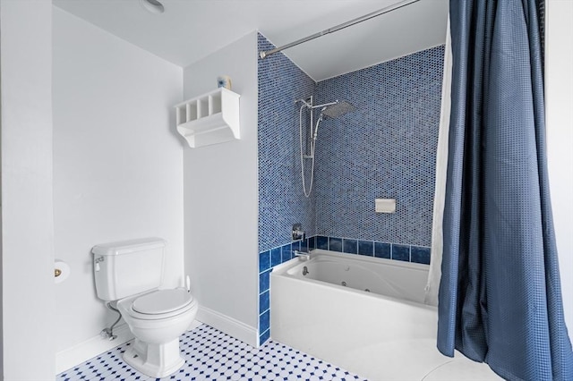 full bath featuring tile patterned flooring, shower / tub combo, toilet, and baseboards