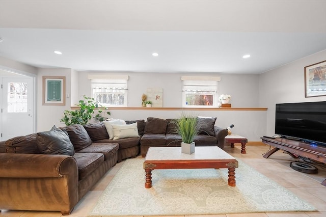 living area with light tile patterned floors and recessed lighting