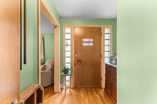 entrance foyer featuring light wood-type flooring and a wealth of natural light