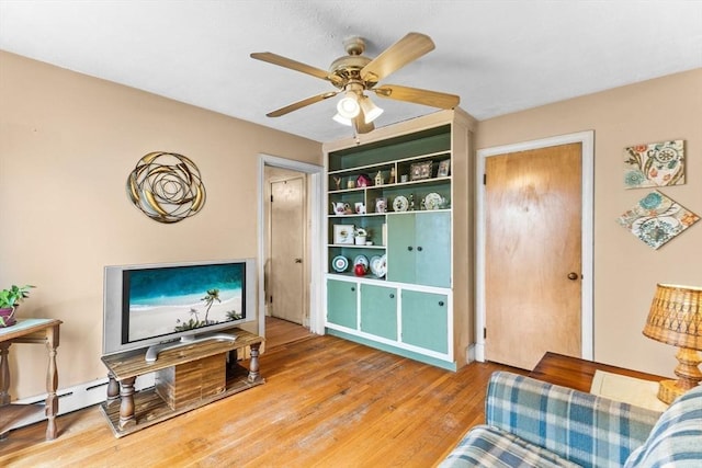 living area featuring ceiling fan and light wood-type flooring