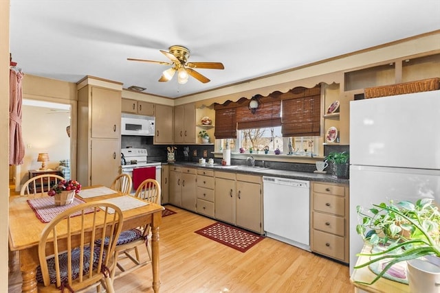 kitchen featuring dark countertops, white appliances, open shelves, and light wood finished floors