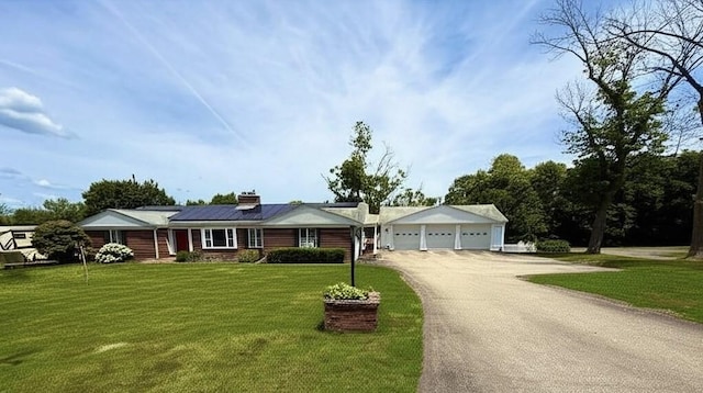 74 Fiske Hill Rd, Sturbridge, MA 01566 - ranch-style house with driveway, a front yard, a garage, and a chimney