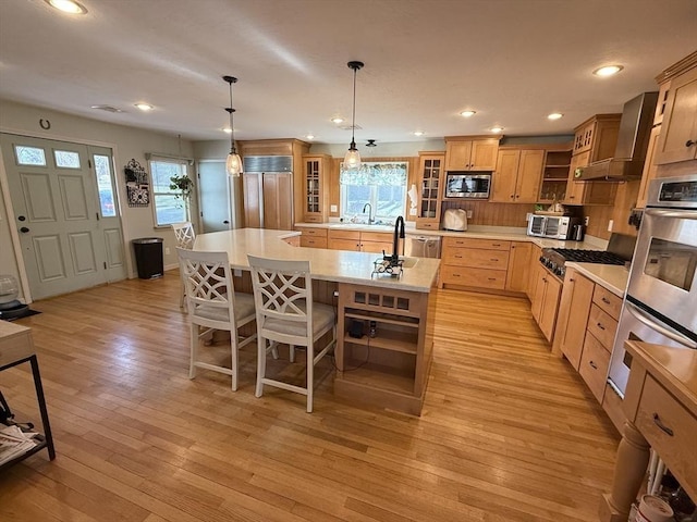 74 Fiske Hill Rd, Sturbridge, MA 01566 - kitchen featuring built in appliances, open shelves, a sink, an island with sink, and healthy amount of natural light