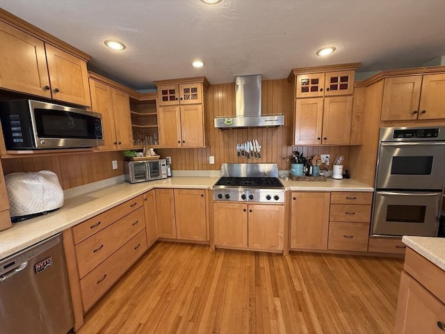 74 Fiske Hill Rd, Sturbridge, MA 01566 - kitchen with wall chimney exhaust hood, appliances with stainless steel finishes, light wood-style floors, light countertops, and open shelves