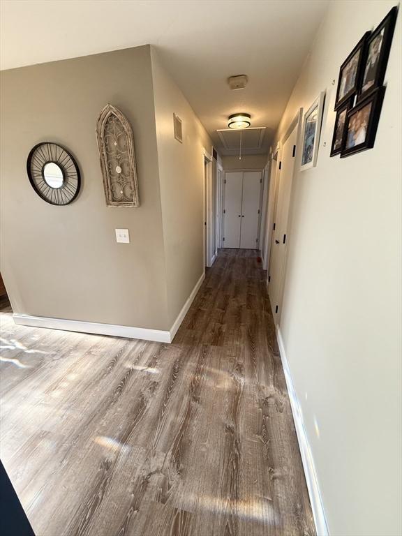 74 Fiske Hill Rd, Sturbridge, MA 01566 - hallway with attic access, wood finished floors, and baseboards