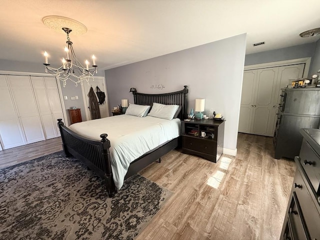 74 Fiske Hill Rd, Sturbridge, MA 01566 - bedroom featuring light wood-style floors and a chandelier