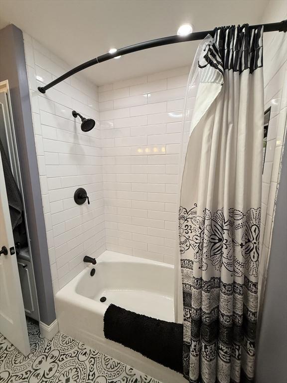 74 Fiske Hill Rd, Sturbridge, MA 01566 - bathroom featuring tile patterned flooring and shower / bathtub combination with curtain