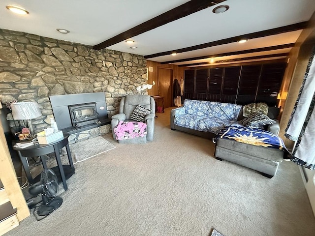 74 Fiske Hill Rd, Sturbridge, MA 01566 - living area with carpet floors, beamed ceiling, and a wood stove