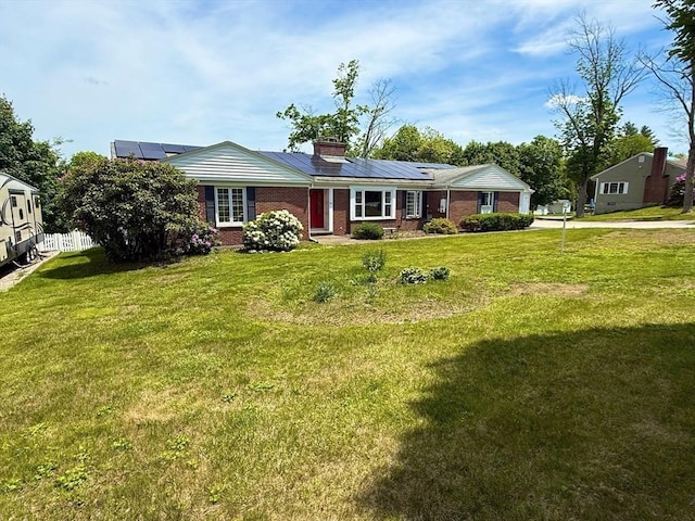 74 Fiske Hill Rd, Sturbridge, MA 01566 - ranch-style home with solar panels, brick siding, and a chimney