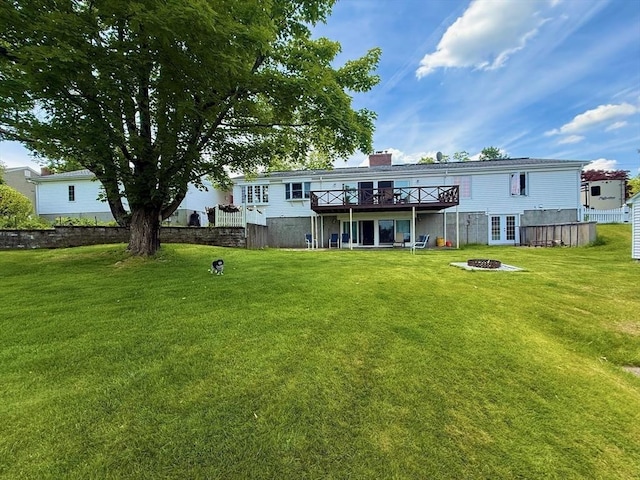 74 Fiske Hill Rd, Sturbridge, MA 01566 - rear view of property with an outdoor fire pit, a deck, a lawn, and a chimney