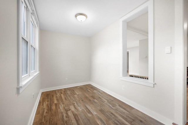 unfurnished room with hardwood / wood-style floors