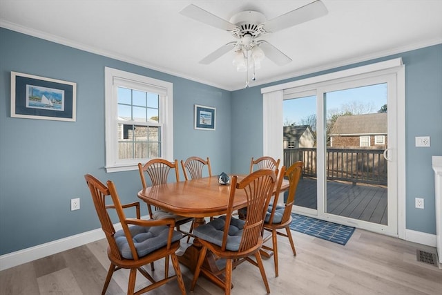 56 Baxter Ave, Yarmouth, MA 02673 - dining space featuring light wood-type flooring, ornamental molding, and ceiling fan