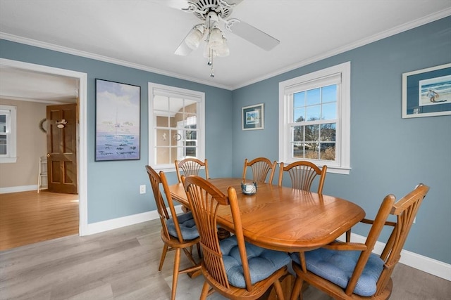 56 Baxter Ave, Yarmouth, MA 02673 - dining area featuring light wood-style flooring, crown molding, and baseboards