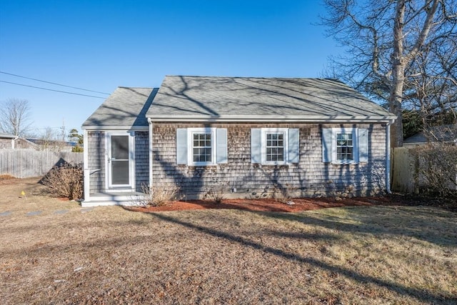 56 Baxter Ave, Yarmouth, MA 02673 - view of front of house with fence, roof with shingles, and a front yard