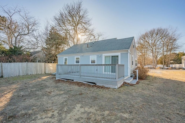 56 Baxter Ave, Yarmouth, MA 02673 - back of house featuring a lawn, fence, and a wooden deck