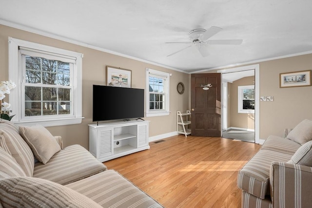 56 Baxter Ave, Yarmouth, MA 02673 - living area featuring baseboards, visible vents, crown molding, and light wood finished floors