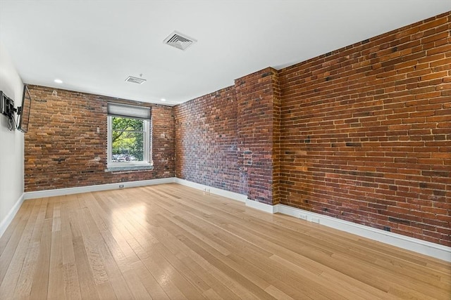 343 Commercial St Unit 212, Boston, MA 02109 - unfurnished room with baseboards, light wood finished floors, brick wall, and recessed lighting