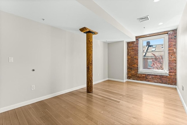 343 Commercial St Unit 212, Boston, MA 02109 - unfurnished room featuring light wood finished floors, baseboards, and brick wall