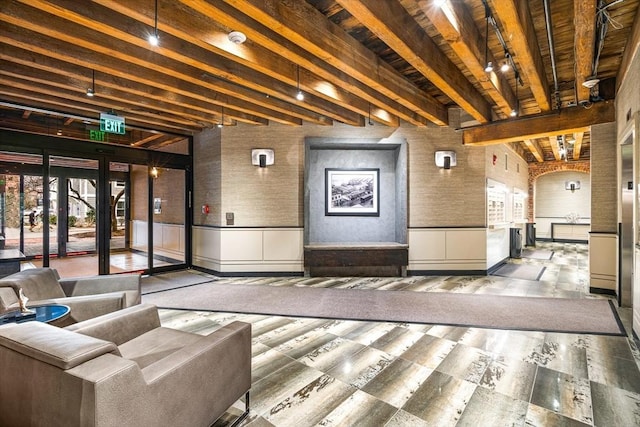 343 Commercial St Unit 212, Boston, MA 02109 - building lobby with brick wall, wood ceiling with exposed beams, and a wainscoted wall