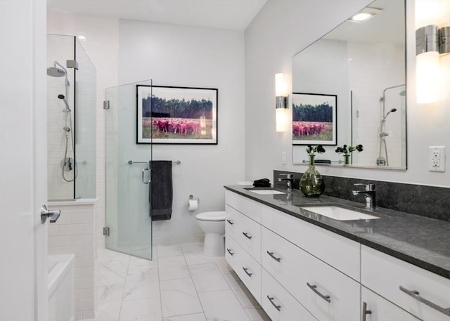 bathroom featuring vanity, walk in shower, and toilet