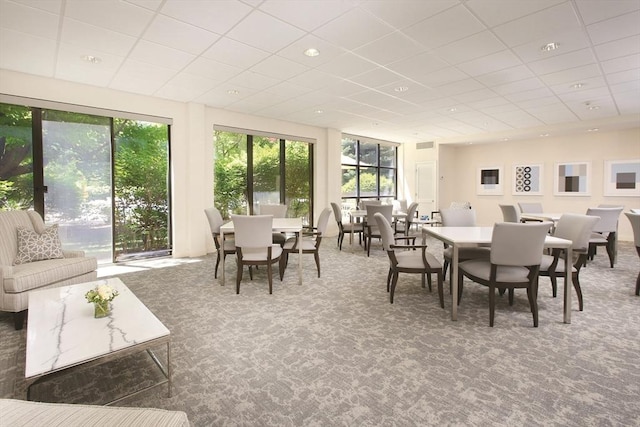 sunroom featuring a drop ceiling