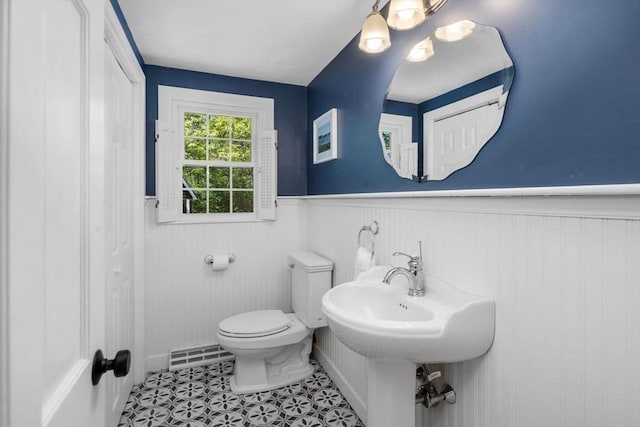 62 Bianca Rd, Duxbury, MA 02332 - bathroom featuring a wainscoted wall, toilet, and tile patterned floors