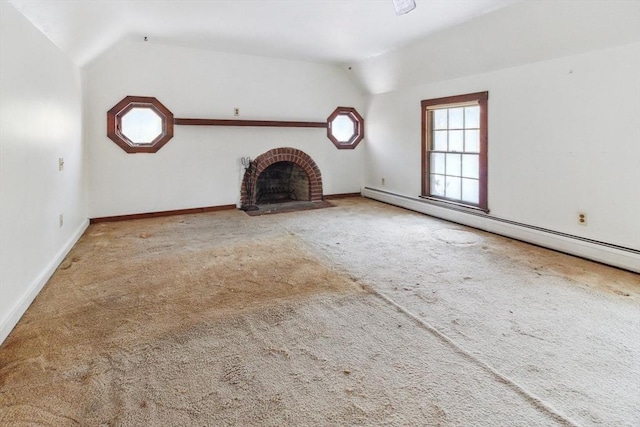 unfurnished living room with lofted ceiling, a brick fireplace, light colored carpet, and a baseboard heating unit