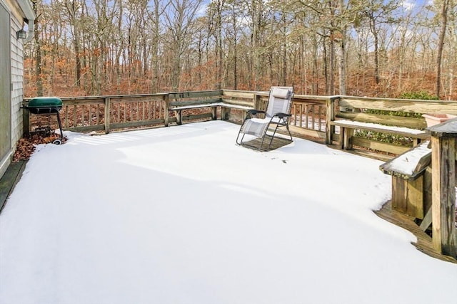 snow covered deck featuring grilling area