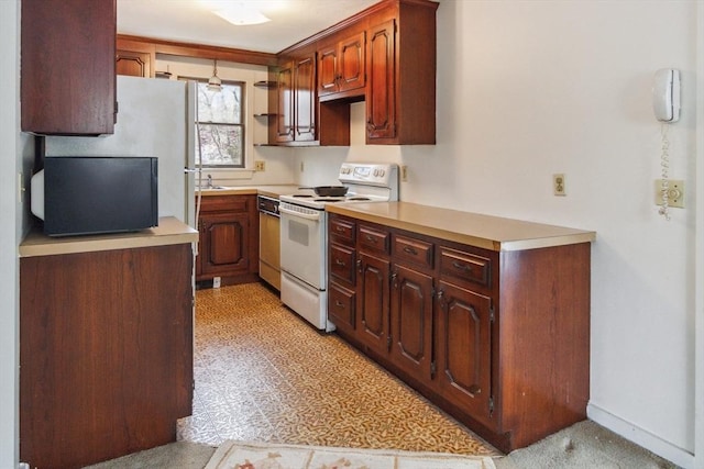 kitchen featuring sink, white electric range oven, and dishwashing machine