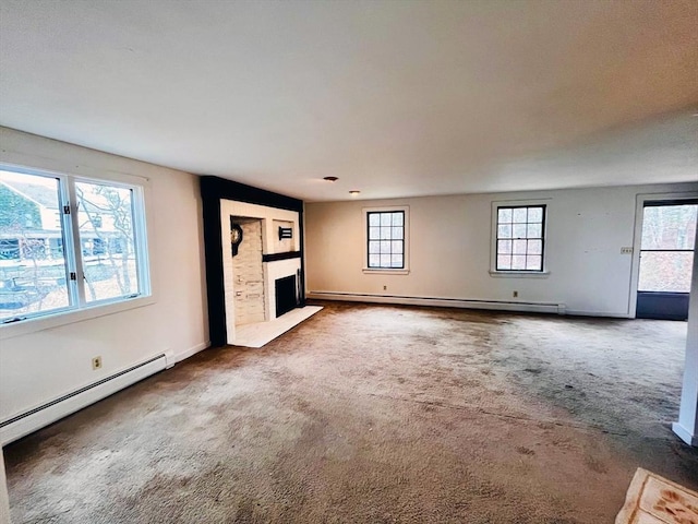 unfurnished living room with a baseboard radiator and carpet