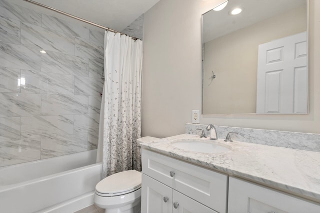 full bathroom with toilet, shower / bath combo, and vanity