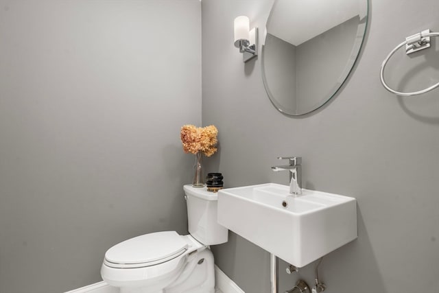 bathroom featuring sink and toilet