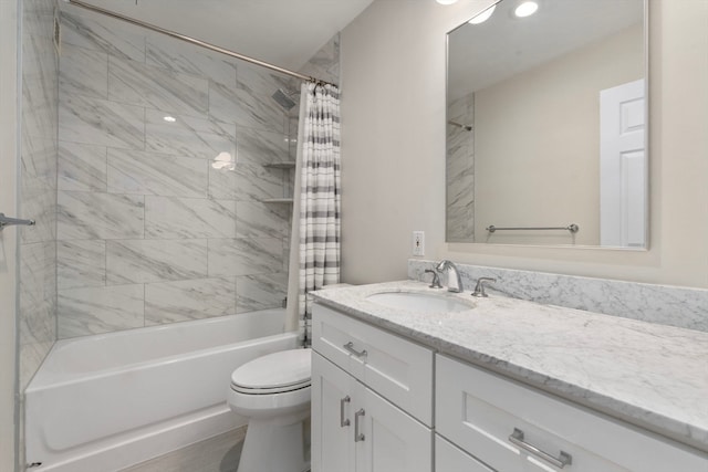 full bathroom featuring vanity, shower / bath combination with curtain, and toilet