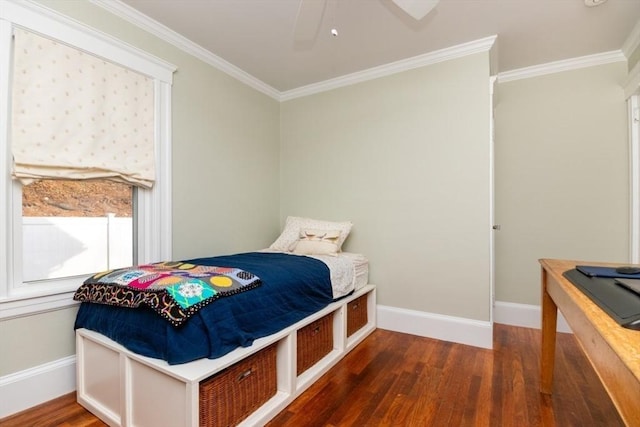 bedroom with ceiling fan, dark wood-type flooring, and ornamental molding