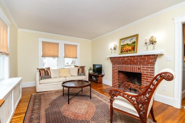 living room featuring a brick fireplace, hardwood / wood-style floors, and ornamental molding