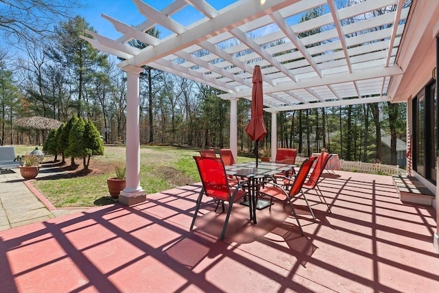 view of patio with a pergola and outdoor dining area