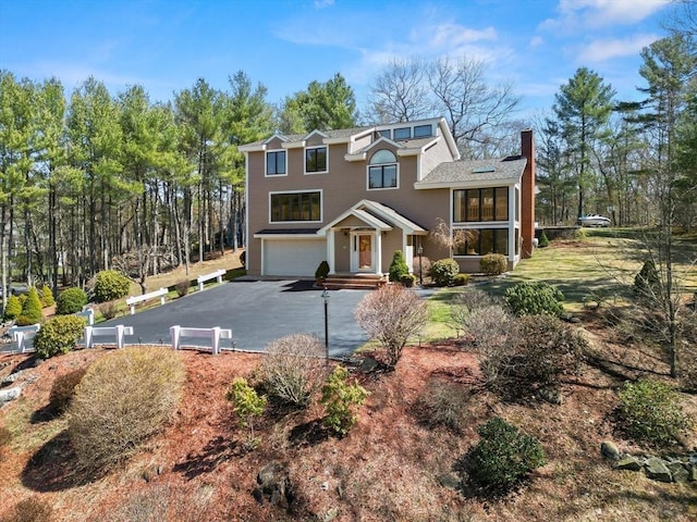 view of front of house with a garage and driveway