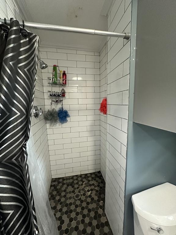 26 Woodman St, Lynn, MA 01905 - full bath featuring tiled shower, ornamental molding, and toilet